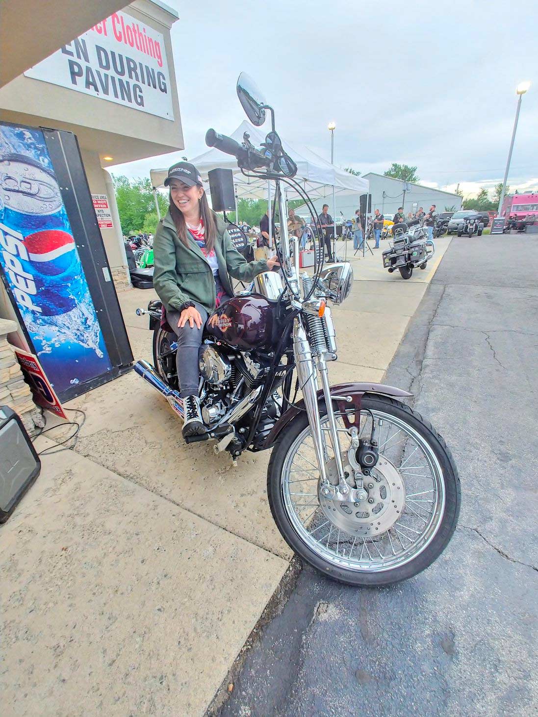 Attorney Christina Gullo sits on a Harley-Davidson Springer Softail