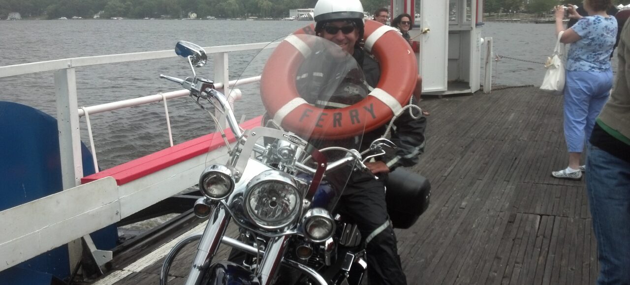 Marketing guy Chris Genovese sits on his 2005 Harley-Davidson Softail Deluxe while crossing Chautauqua Lake on the Bemus Point Ferry