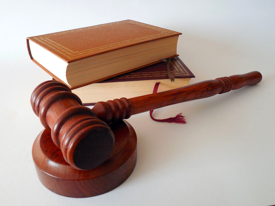 a judge's gavel with two books